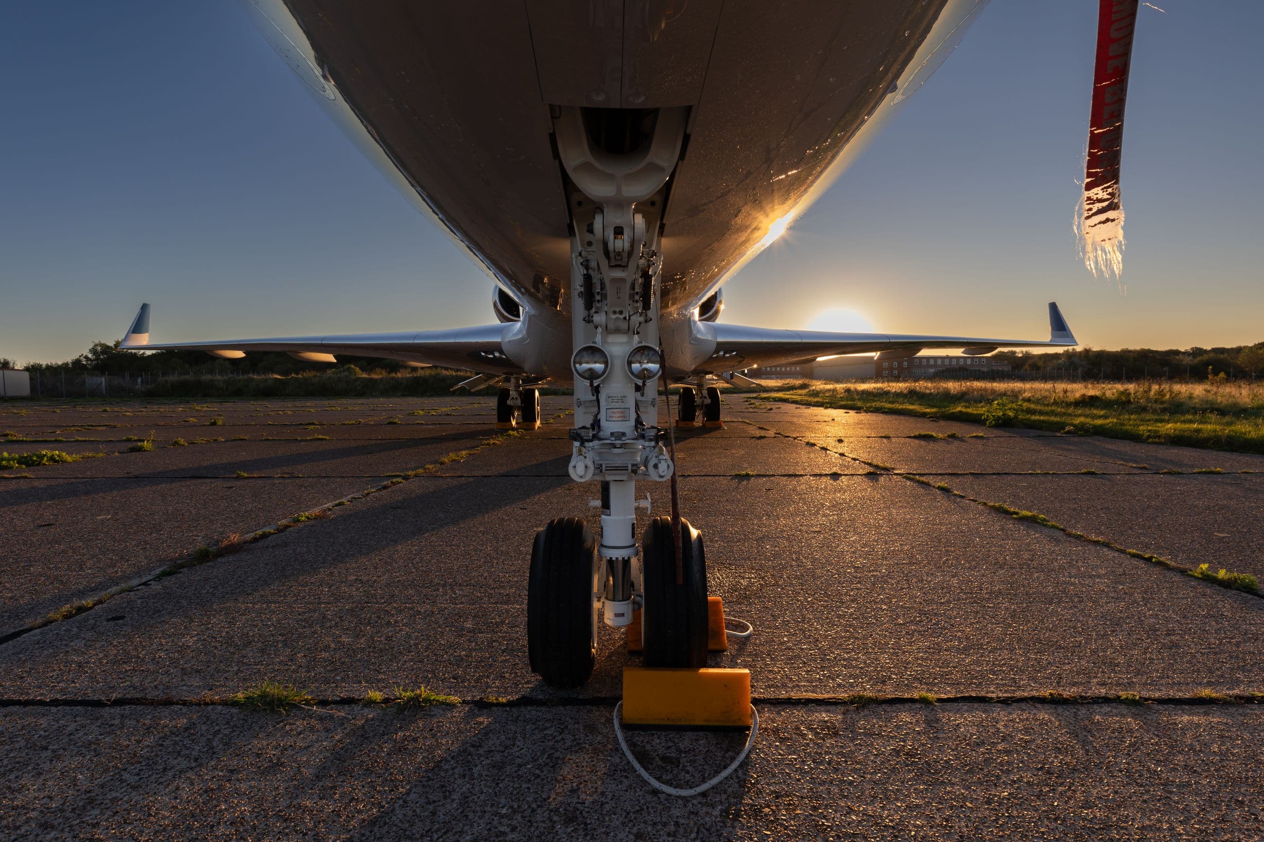 Business jet on the apron at sunset